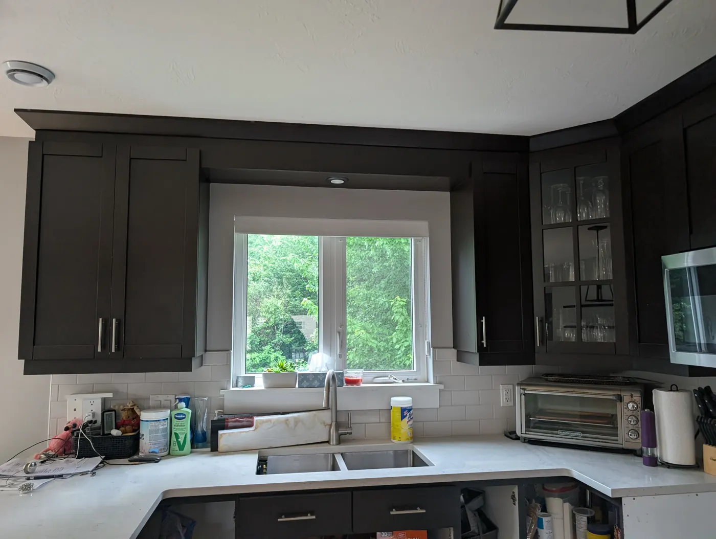 Kitchen with dark brown cabinets before the update